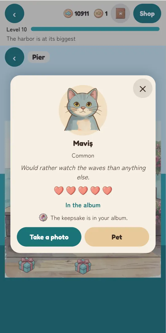 Purrbor visitor card for Maviş: rarity, a one-line personality, five full hearts, the keepsake in the album, and Take a photo and Pet buttons
